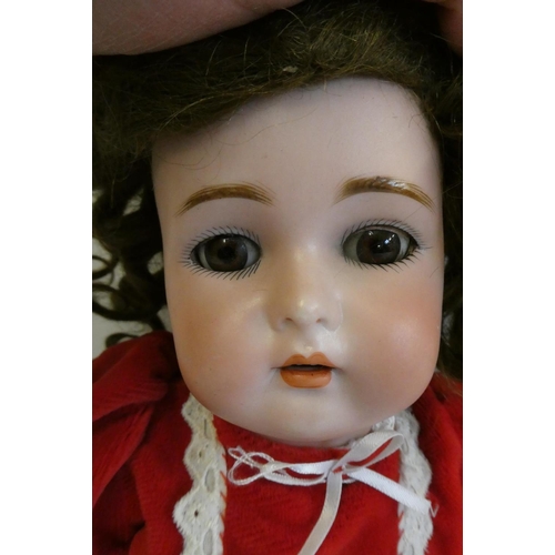 88 - A Kammer & Reinhardt bisque socket head doll, with brown glass sleeping eyes, open mouth, teeth, pie... 