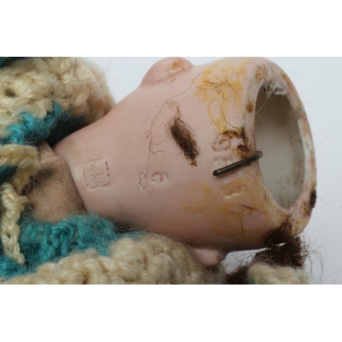 95 - A Heubach bisque socket head googly doll, with blue glass sleepy and sideways glancing eyes, closed ... 