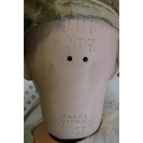 99 - A J.D. Kestner bisque socket head character doll, with brown glass sleeping eyes, open mouth, applie... 