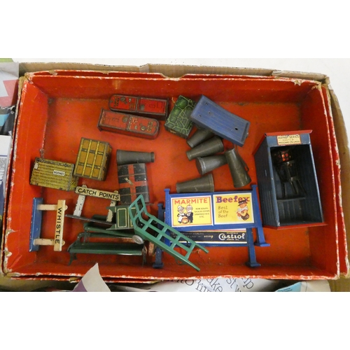 1043 - Hornby trackside accessories including luggage cases, track signs and milk churns, fair