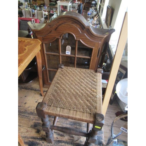 1007 - GLAZED OAK WALL CABINET AND A WOVEN TOP STOOL