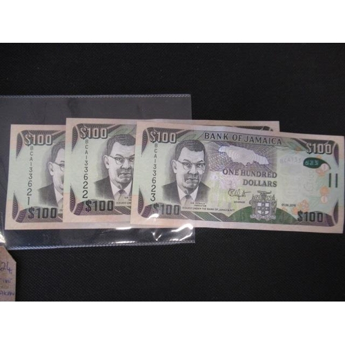 731 - THREE CONSECUTIVE NUMBERED JAMAICAN 100 DOLLAR BANK NOTES