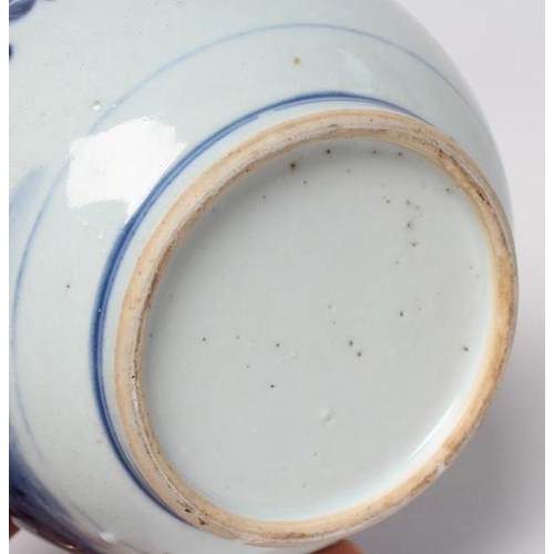 1 - A CHINESE PORCELAIN GUGLET of typical bottle form, painted in underglaze blue with a pagoda in lands... 