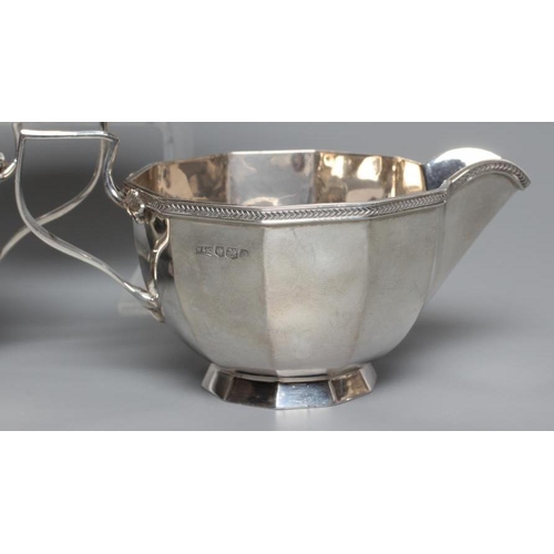 106 - A SILVER FOUR PIECE TEA AND COFFEE SERVICE, by Walker & Hall, Sheffield 1924, of panelled circular f... 