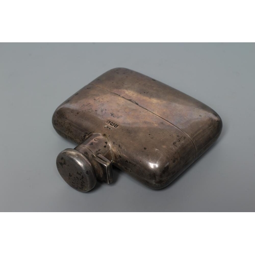 107 - A SILVER HIP FLASK, probably by Deakin & Francis, Birmingham 1917, of concave oblong form with pull-... 