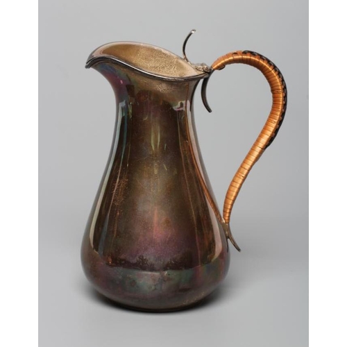 110 - A SILVER HOT WATER JUG, by James Dixon & Sons, Sheffield 1919, of swept baluster form, the hinged do... 