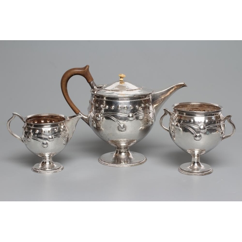 120 - AN EDWARDIAN ARTS AND CRAFTS SILVER THREE PIECE TEA SERVICE, by A E Jones, Birmingham 1910 (sugar) a... 