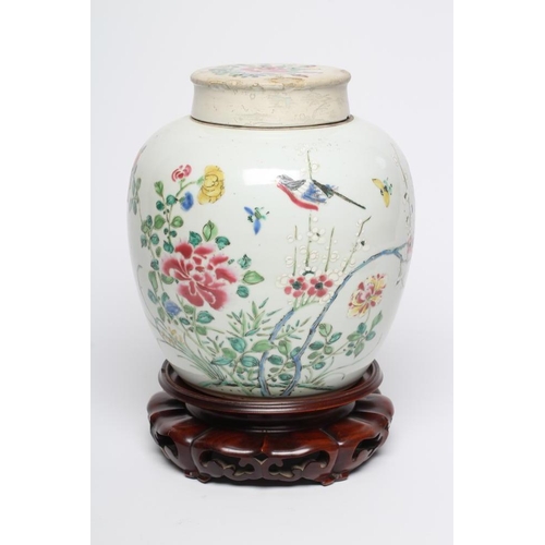 13 - A CHINESE PORCELAIN LARGE JAR AND COVER painted in colours with a finch perched upon a blossoming br... 