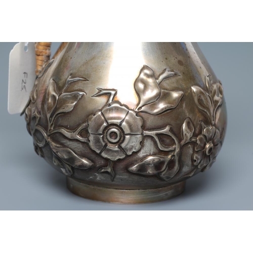 144 - A LATE VICTORIAN ART NOUVEAU SILVER HOT WATER JUG, by Holland, Aldwinckle & Slater, London 1896, of ... 