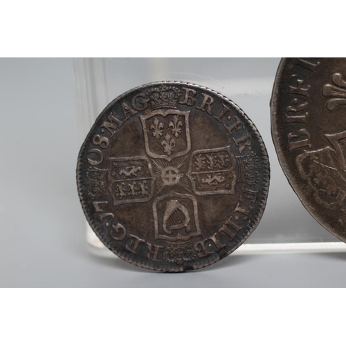 152 - TWO QUEEN ANNE SILVER COINS, comprising 1706 crown with crowned cruciform back, plumes and roses, an... 