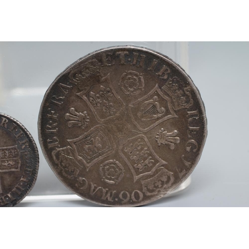 152 - TWO QUEEN ANNE SILVER COINS, comprising 1706 crown with crowned cruciform back, plumes and roses, an... 