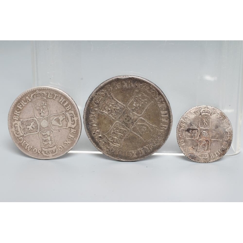 153 - THREE JAMES II SILVER COINS, comprising a 1688 crown with crown cruciform back, a 1686 half crown an... 