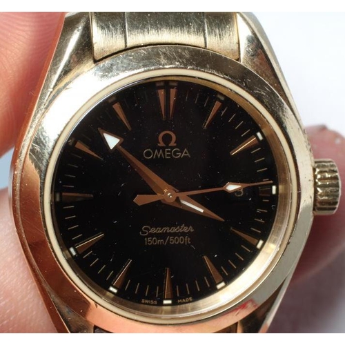 171 - A MID SIZE 18CT GOLD OMEGA SEAMASTER AQUA TERRA WRISTWATCH, the black dial with applied triangular b... 