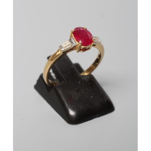 175 - A RUBY AND DIAMOND RING, the oval facet cut ruby claw set to tapering shoulders, each channel set wi... 