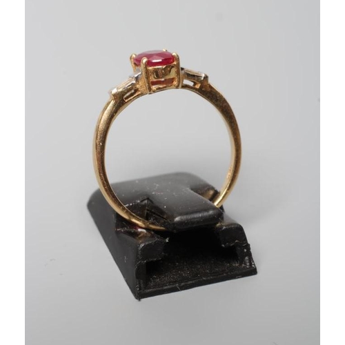 175 - A RUBY AND DIAMOND RING, the oval facet cut ruby claw set to tapering shoulders, each channel set wi... 