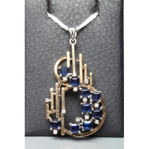 179 - A MODERNIST SAPPHIRE AND DIAMOND PENDANT, modelled as an abstract S with vertical bars between, claw... 