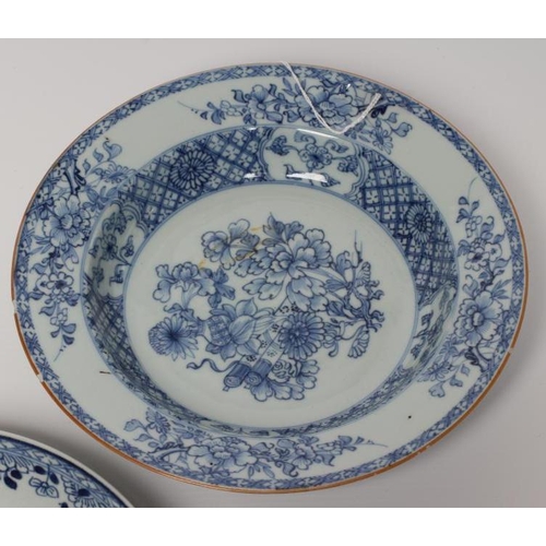 2 - TWO CHINESE PORCELAIN SAUCER DISHES painted in underglaze blue with a flower spray within a diapered... 