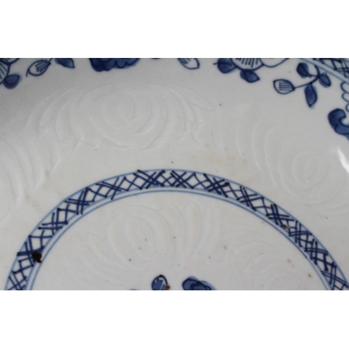 2 - TWO CHINESE PORCELAIN SAUCER DISHES painted in underglaze blue with a flower spray within a diapered... 