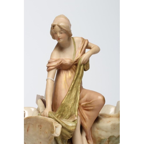 39 - ROYAL DUX PORCELAIN ART NOUVEAU FIGURAL CENTREPIECE modelled as a young maiden standing between a pa... 