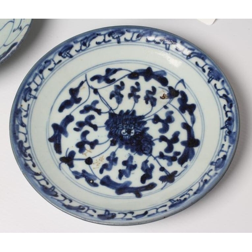 4 - A CHINESE PORCELAIN BOWL of flared circular form, painted in underglaze blue with flowers within a d... 