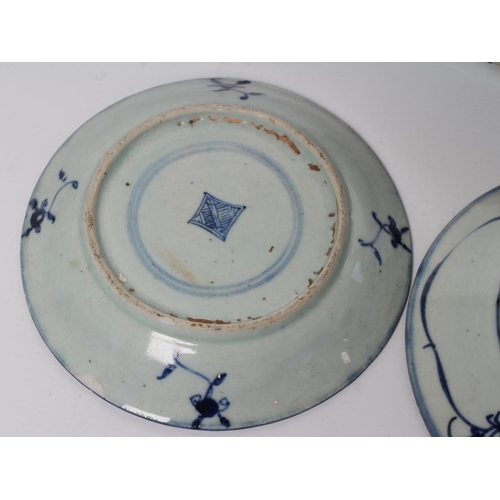 4 - A CHINESE PORCELAIN BOWL of flared circular form, painted in underglaze blue with flowers within a d... 