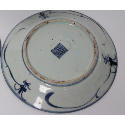 4 - A CHINESE PORCELAIN BOWL of flared circular form, painted in underglaze blue with flowers within a d... 