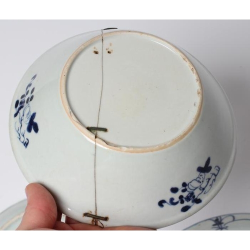 4 - A CHINESE PORCELAIN BOWL of flared circular form, painted in underglaze blue with flowers within a d... 