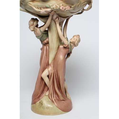 40 - A ROYAL DUX PORCELAIN ART NOUVEAU FIGURAL CENTREPIECE modelled as two young maidens holding aloft a ... 