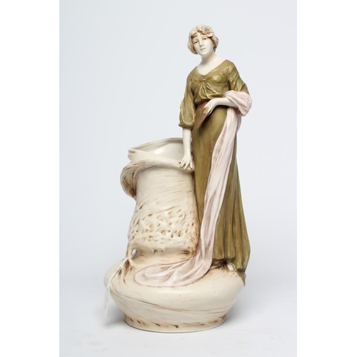 41 - A ROYAL DUX PORCELAIN ART NOUVEAU FIGURAL VASE, early 20th century, modelled as a young maiden weari... 