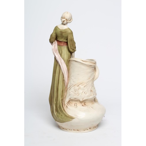 41 - A ROYAL DUX PORCELAIN ART NOUVEAU FIGURAL VASE, early 20th century, modelled as a young maiden weari... 