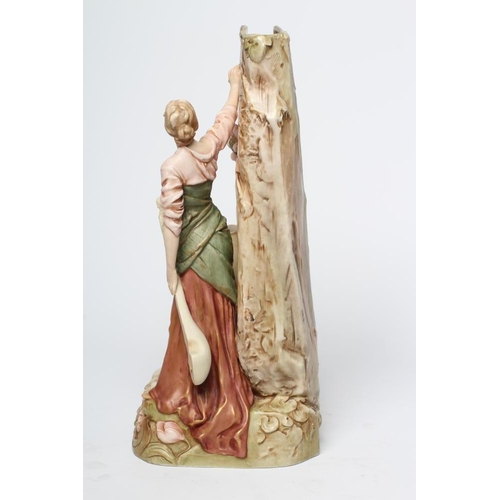 42 - A ROYAL DUX PORCELAIN FIGURAL VASE, early 20th century, modelled as a young maiden holding a long ne... 