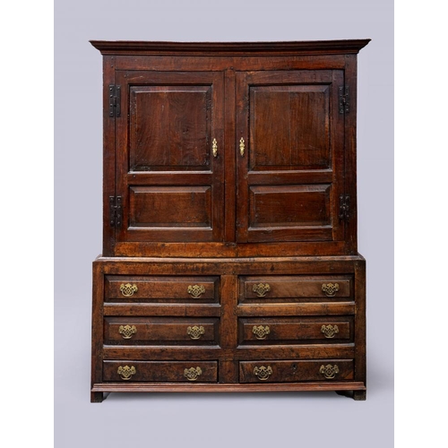 630 - A JOINED OAK PRESS CUPBOARD, mid 18th century, the moulded cornice over a pair of twin fielded panel... 