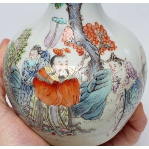 7 - A CHINESE PORCELAIN BOTTLE VASE painted in colours with a vignette of three figures below a gnarled ... 