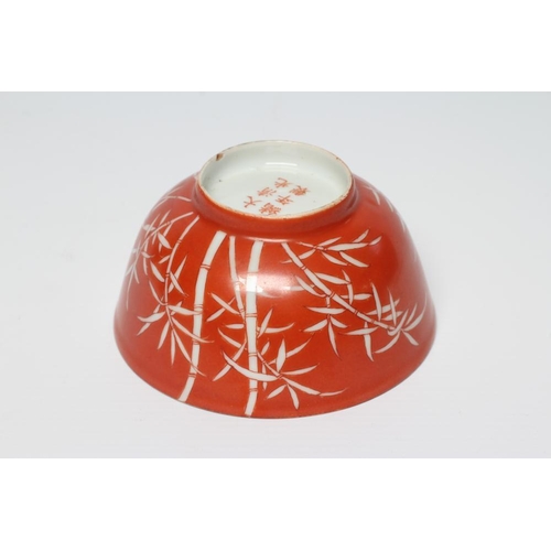 8 - A CHINESE PORCELAIN SMALL BOWL, the iron red exterior reverse decorated with bamboo, six character m... 