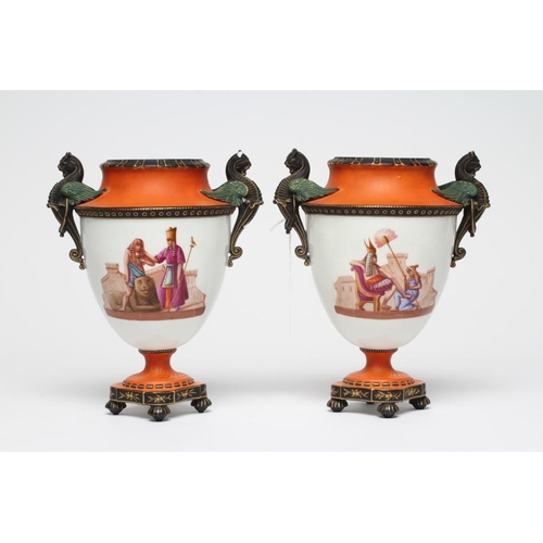 84 - A PAIR OF FRENCH WHITE OPAQUE GLASS EMPIRE STYLE URNS, mid 19th century, the swept shoulders with tw... 