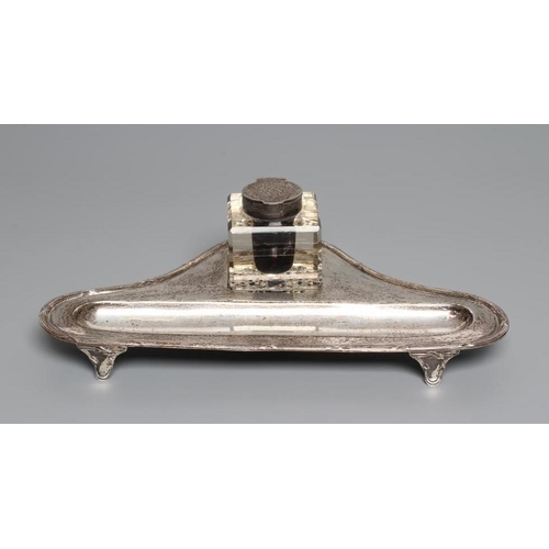 97 - A SCOTTISH SILVER DESK STANDISH, by Hamilton & Inches, Edinburgh 1913, of triangular form with a ree... 