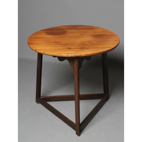 629 - A CRICKET TABLE, 19th century and later, the fruitwood top and waved frieze on square section oak le... 