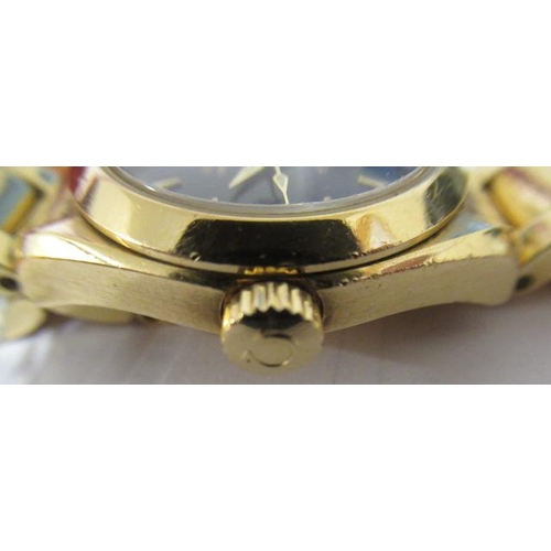 171 - A MID SIZE 18CT GOLD OMEGA SEAMASTER AQUA TERRA WRISTWATCH, the black dial with applied triangular b... 