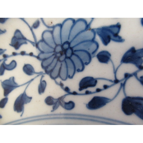 5 - A CHINESE PORCELAIN DISH of plain circular form, painted in underglaze blue with a central ribbon ti... 