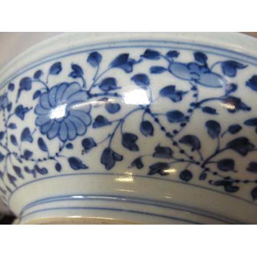 5 - A CHINESE PORCELAIN DISH of plain circular form, painted in underglaze blue with a central ribbon ti... 