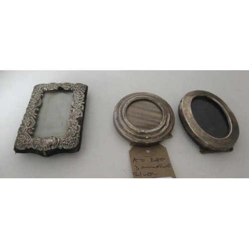 257 - THREE MINIATURE SILVER PHOTO FRAMES