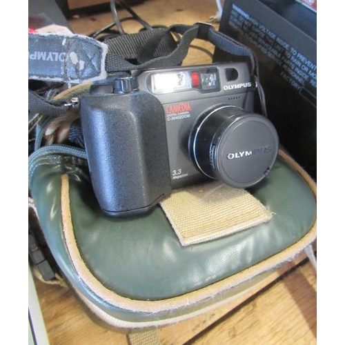 63 - CASED DIGITAL CAMERA