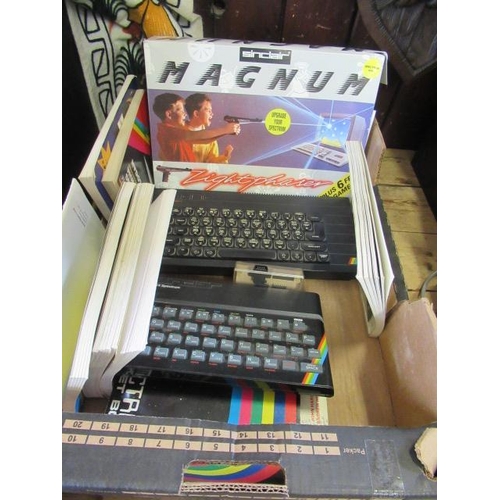 65 - TWO SINCLAIR ZX SPECTRUM COMPUTERS WITH BOXED LIGHT PHASER GAMES AND RELEVANT BOOKS