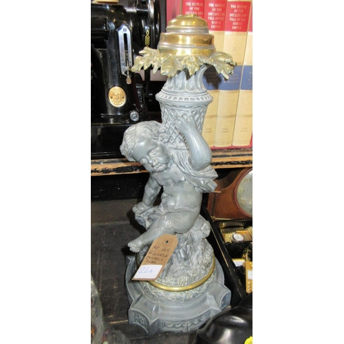 22A - FIGURAL PEWTER AND BRASS CANDLESTICK