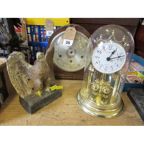 36 - QUARTZ CLOCK UNDER DOME AND HEAVY EAGLE ORNAMENT