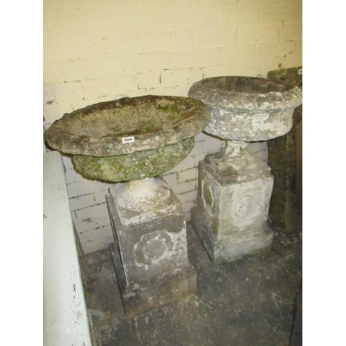 900 - TWO COMPOSITE GARDEN URNS