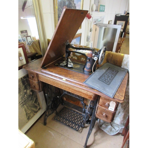 1055 - SINGER SEWING MACHINE AND STAND