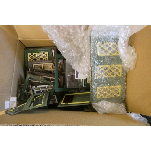 104 - Three boxes of doll's house building items, including vintage metal windows and doors, modern wooden... 