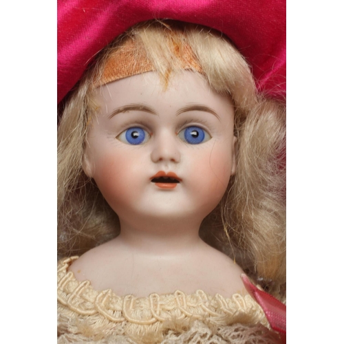 109 - A bisque shoulder head musical marotte doll, with blue glass fixed eyes, open mouth, teeth, blond wi... 