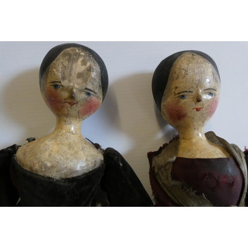 11 - Two Victorian peg dolls with carved and painted head and torso, cloth upper limbs and carved wooden ... 